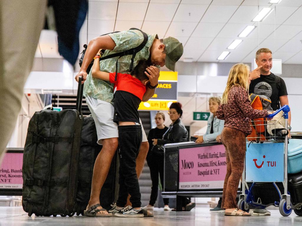 Travellers arrive after returning from the Greek island of Rhodes where evacuations are underway due to wildfires. Picture: AFP / Netherlands OUT