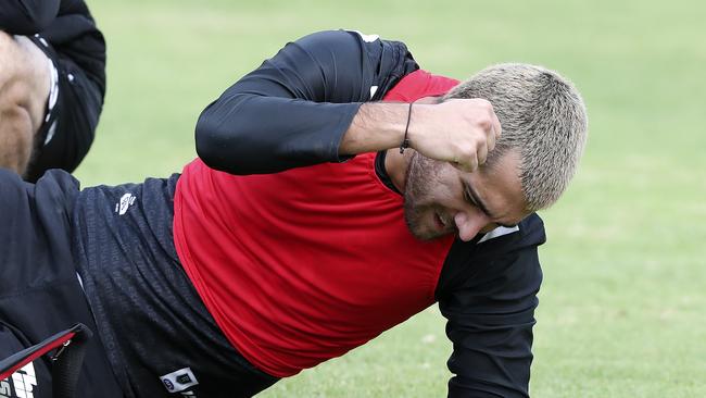 Riley Bonner punches the turf in frustration after injuring his lower leg at training. Picture: Sarah Reed.