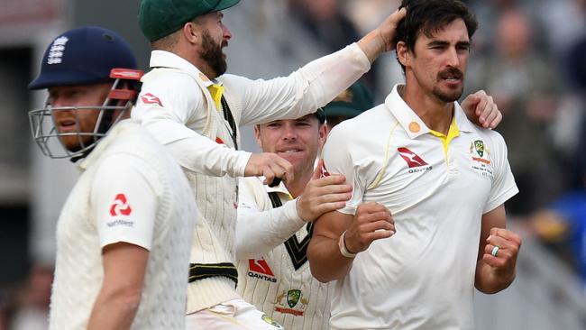 Mitchell Starc, right, broke a stubborn partnership. Picture: AFP