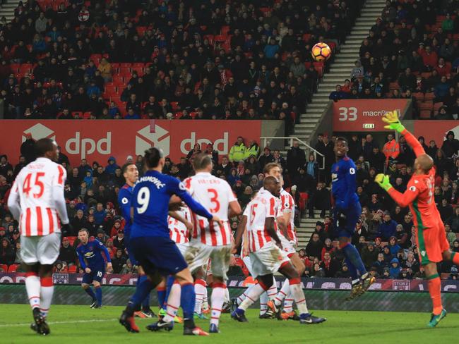 Manchester United's English striker Wayne Rooney (2L) hits the free-kick.