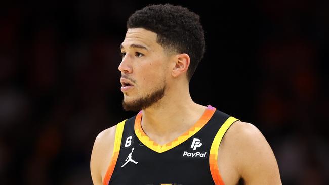 PHOENIX, ARIZONA - APRIL 25: Devin Booker #1 of the Phoenix Suns dribbles during the fourth quarter against the LA Clippers in game five of the Western Conference First Round Playoffs at Footprint Center on April 25, 2023 in Phoenix, Arizona. NOTE TO USER: User expressly acknowledges and agrees that, by downloading and or using this photograph, User is consenting to the terms and conditions of the Getty Images License Agreement. (Photo by Christian Petersen/Getty Images)