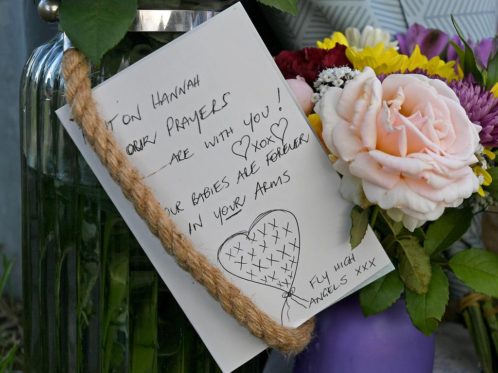 A card for the family says to “fly with the angels”. Picture: AAP image, John Gass.