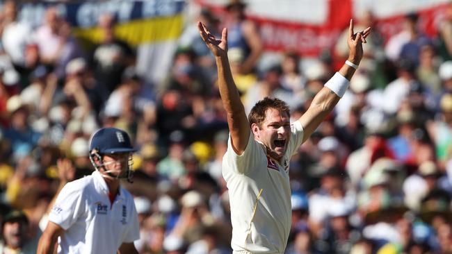 Bowler Ryan Harris celebrates the wicket of batsman Alistair Cook during third Test match of Australia v England Ashes cricket series at the WACA Ground in Perth.