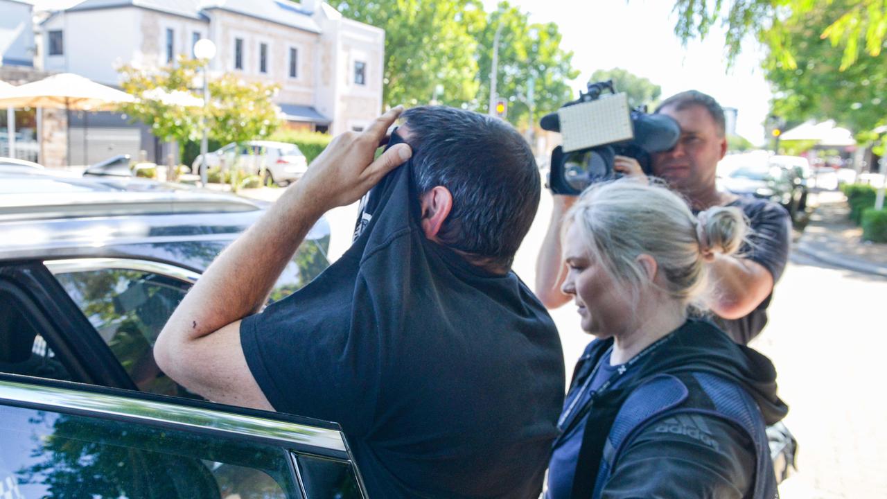 A man is arrested following an alleged confrontation at a house on Halifax Street in the Adelaide CBD. Picture: Brenton Edwards