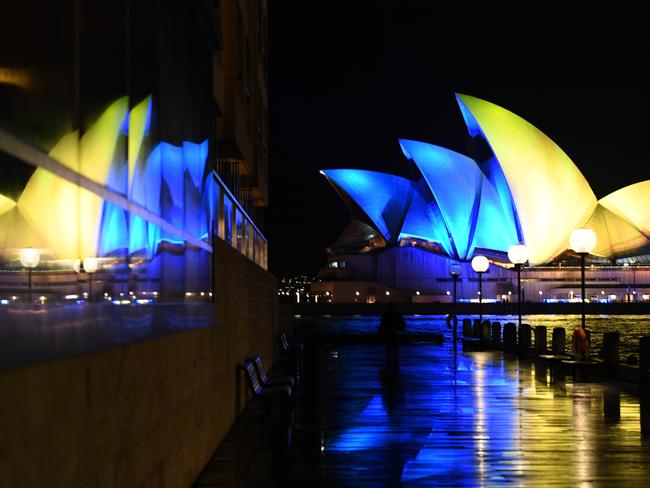 The Sydney Opera House sails were lit with the colours of the Ukrainian national flag on Monday. Picture: James D. Morgan/Getty Images