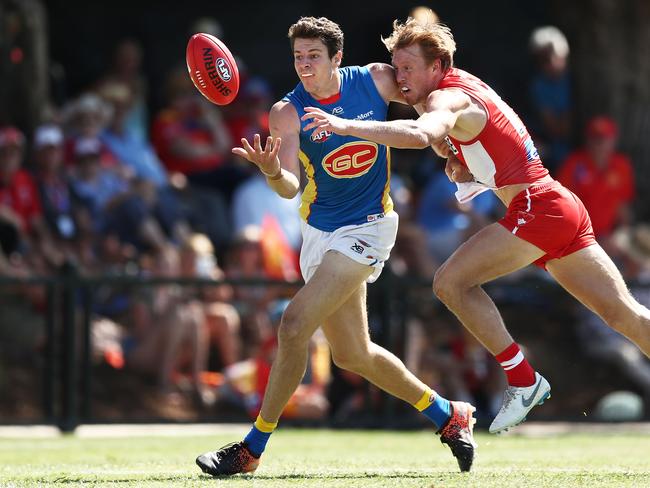 Chris Burgess of the Suns is challenged by Callum Mills of the Swans during the 2019 JLT Community Series AFL match between the Sydney Swans and the Gold Coast Suns at Oakes Oval on March 10, 2019 in Lismore, Australia. (Photo by Matt King/Getty Images)