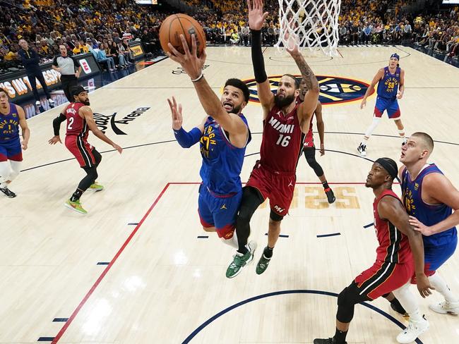 Jamal Murray #27 of the Denver Nuggets drives to the basket against Caleb Martin #16 of the Miami Heat. Photo: Kyle Terada - Pool/Getty Images.