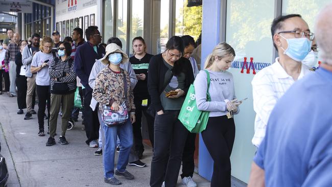 Hundreds of people line up for the opening of Aldi in North Strathfield on Wednesday. Picture: Dylan Robinson