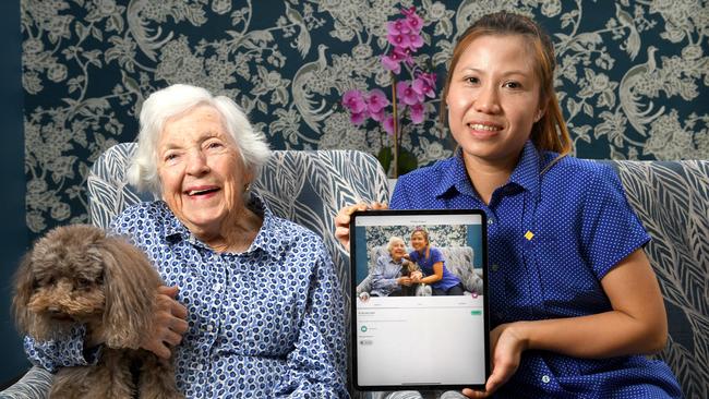 St Louis nursing home resident Alice Bungey, 89, with carer Ying Sinthuwanik. Picture: Tricia Watkinson