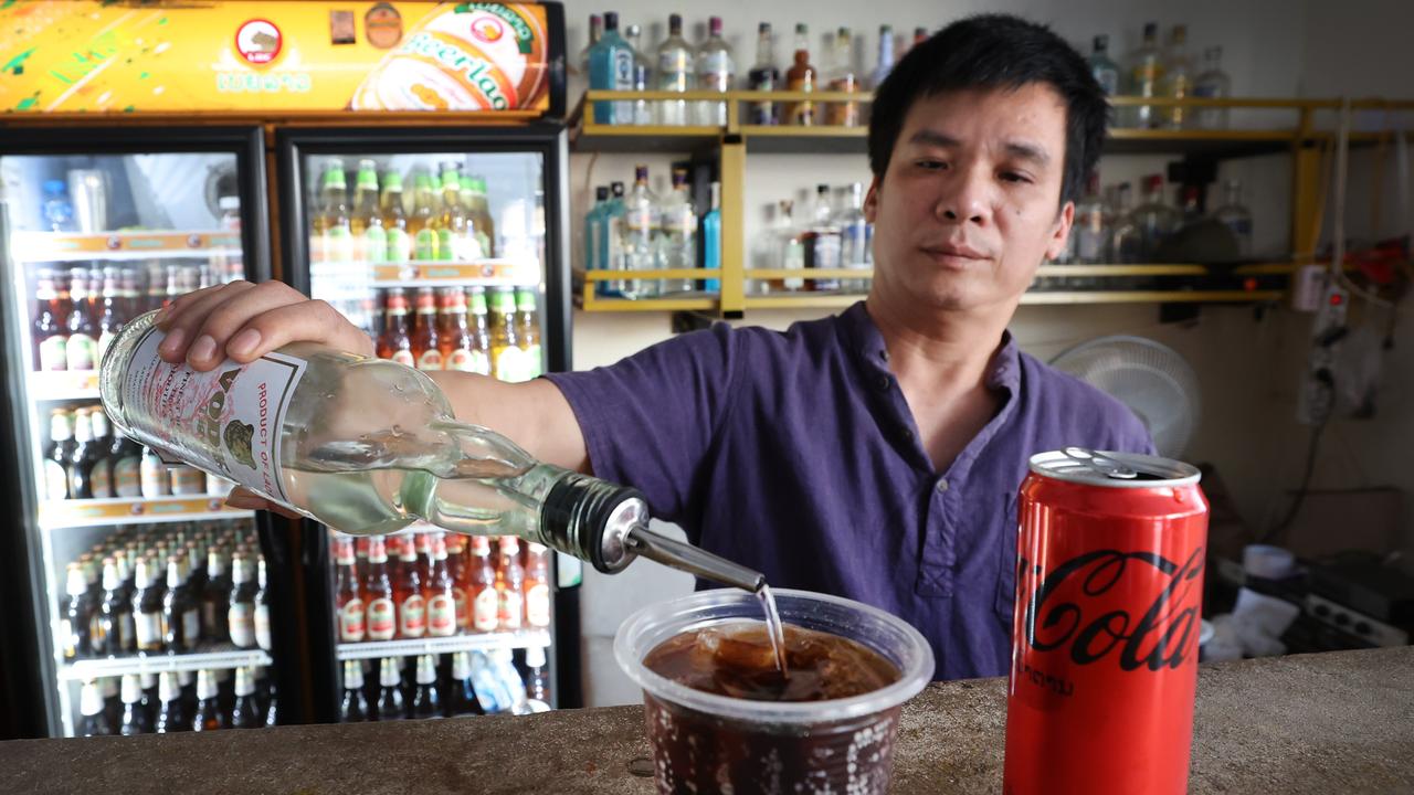 Nana Backpackers Hostel bartender Toan Van Vanng pours in the same Vodka and Coke drink the women consumed.