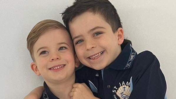 Harry, who is starting his prep year at Coorparoo's St James Catholic Primary School, with his brother and Year 2 student Ollie.