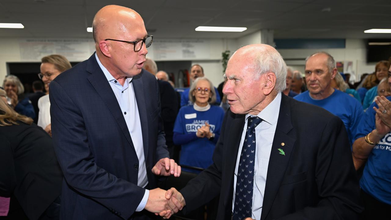 Defeated Liberal leader Peter Dutton shakes hands with former Prime Minister John Howard in Sydney before the election result. Picture: Dan Peled/Getty Images