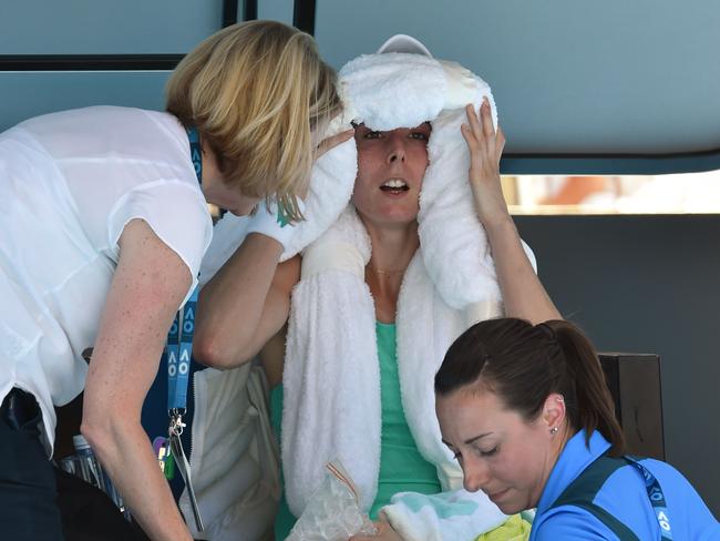 Alize Cornet receives treatment during her third round defeat. Picture: AFP