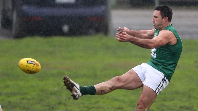 Gembrook Cockatoo’s Michael Firrito takes a kick. Picture: Stuart Milligan