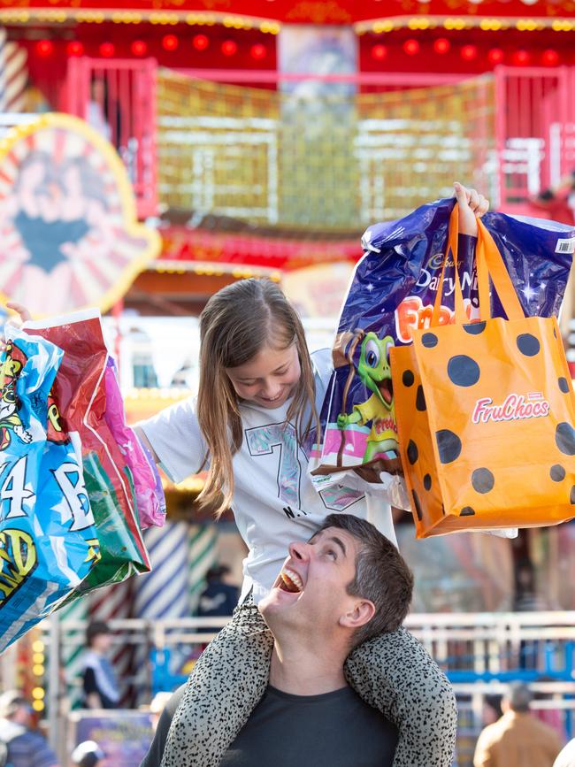 Luke Say and daughter Scarlet, 9, of Athelstone enjoy a day out in the sun at the Royal Adelaide Show, 2023. Picture: Brett Hartwig