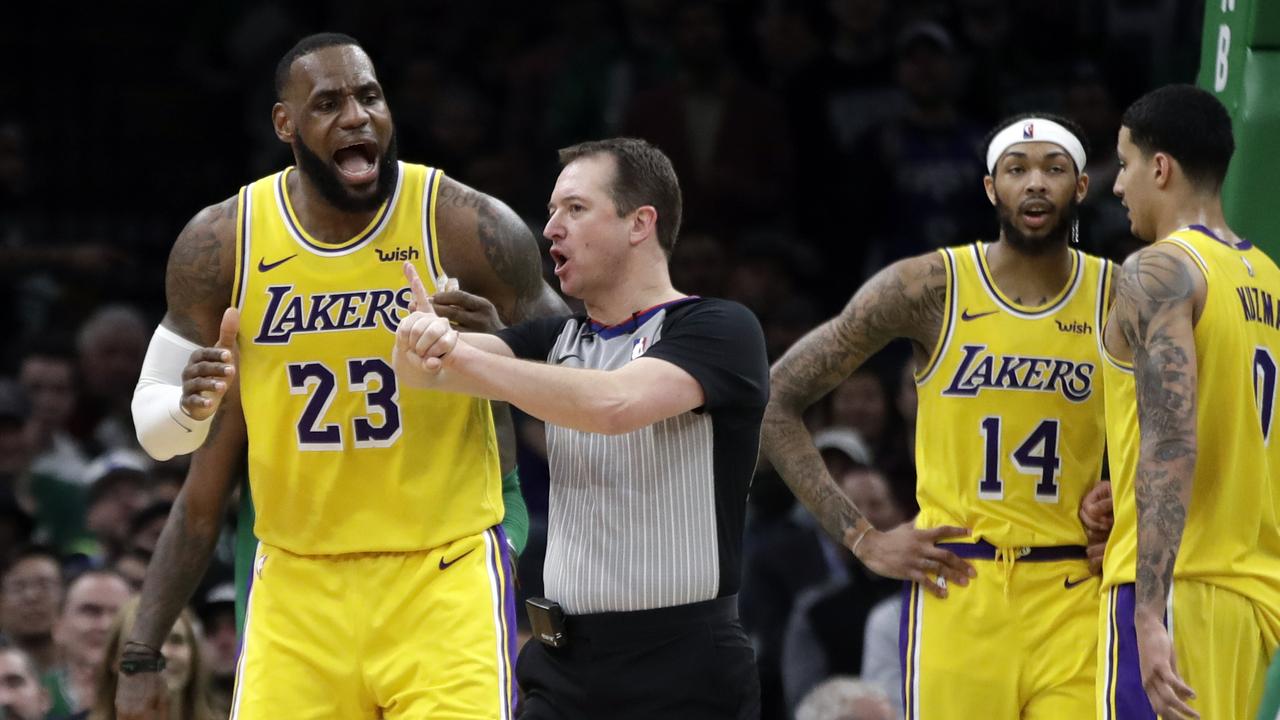 Los Angeles Lakers forward LeBron James (23) argues a call with the referee as Lakers forwards Brandon Ingram (14) and Kyle Kuzma (0) talk to each other in the fourth quarter of an NBA basketball game against the Boston Celtics, Thursday, Feb. 7, 2019, in Boston. (AP Photo/Elise Amendola)