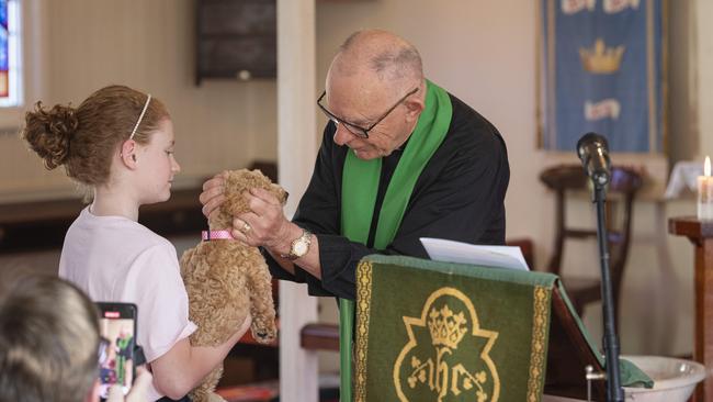 Annie Morgan holding Molly at the Blessing of the Pets at All Saints Anglican Church, Saturday, October 12, 2024. Picture: Kevin Farmer