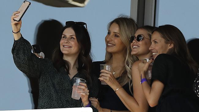 Cat McAteer and pals Bonnie Paine, Emma McCarthy and Becky Boston search for the perfect selfie. Pictures: Getty