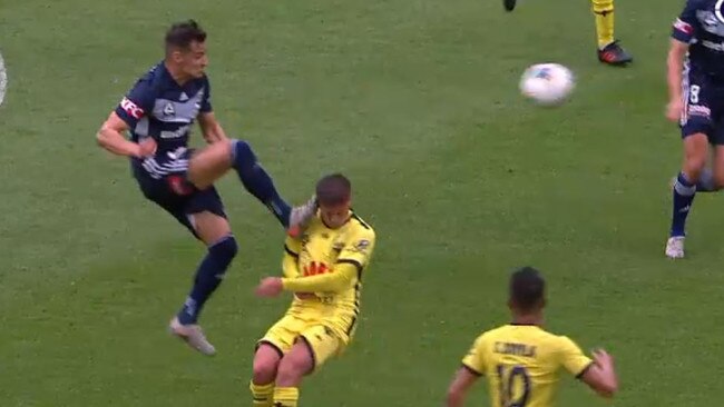 Melbourne Victory midfielder Kristijan Dobras gets the challenge on Wellington Phoenix midfielder Cameron Devlin all wrong and is sent off.