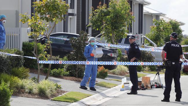 Police at the murder scene where Bowden was gunned down in his driveway. Picture Glenn Hampson