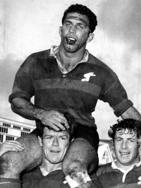 John Sattler being carried from the field after captaining Souths to the 1970 premiership with a shattered jaw. Picture: Supplied
