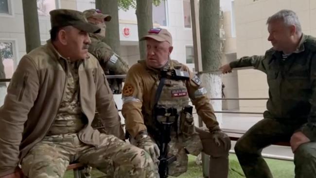 Yevgeny Prigozhin (C) speaking with Lieutenant General Vladimir Alekseev (R) and Russian Defense Deputy Minister Yunus-Bek Evkurov (L) inside the headquarters of the Russian southern military district in the city of Rostov-on-Don. Picture: AFP.