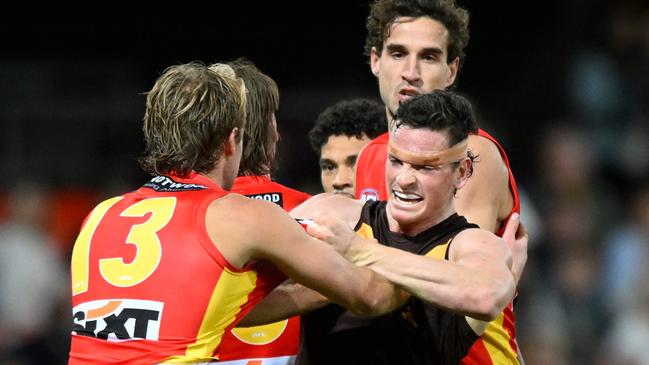 Hawk James Blanck wrestles with Gold Coast’s Jack Lukosius. Picture: Matt Roberts/AFL Photos/via Getty Images