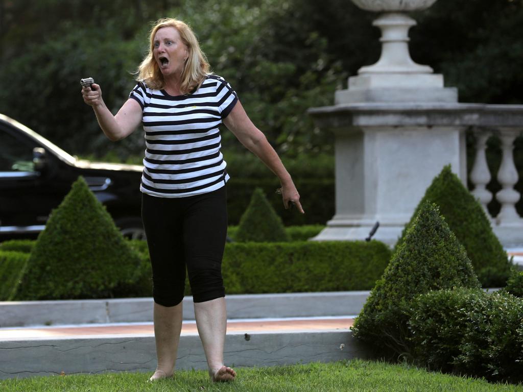 Patricia McCloskey points a pistol at BLM protesters as they march past her palatial mansion in St Louis, Missouri on Sunday night. Picture: Laurie Skrivan/ St. Louis Post-Dispatch/Polaris/australscope