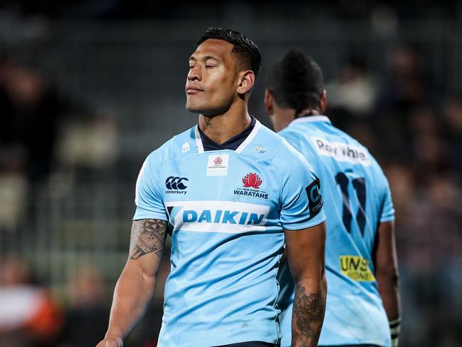 Israel Folau (R) and Taqele Naiyaravoro (L) of the Waratahs leave the field looking dejected after the Round 13 Super Rugby match between the Crusaders and the NSW Waratahs at AMI Stadium in Christchurch, New Zealand, Saturday, May 12, 2018. (AAP Image/SNPA, Martin Hunter) NO ARCHIVING, EDITORIAL USE ONLY