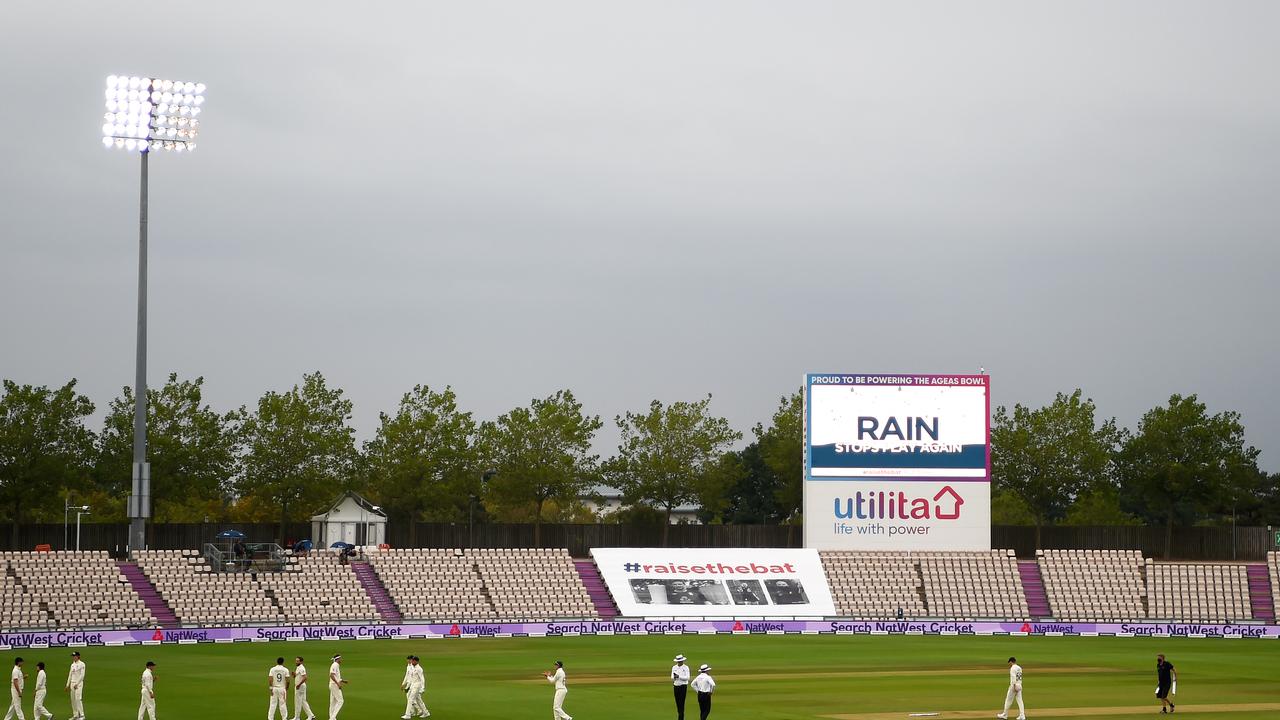 The England players walk off as rain stops play. (Photo by Gareth Copley/Getty Images for ECB)