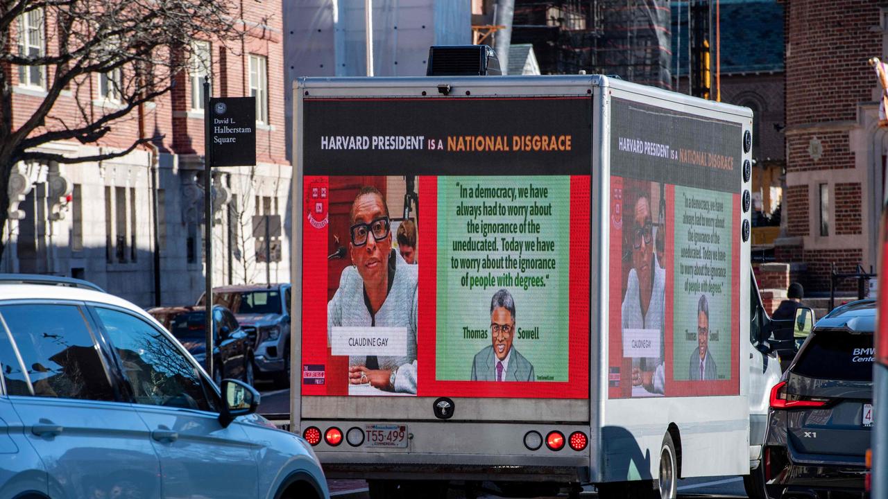 A truck calling the president of Harvard a disgrace drives around Harvard University. Picture: AFP