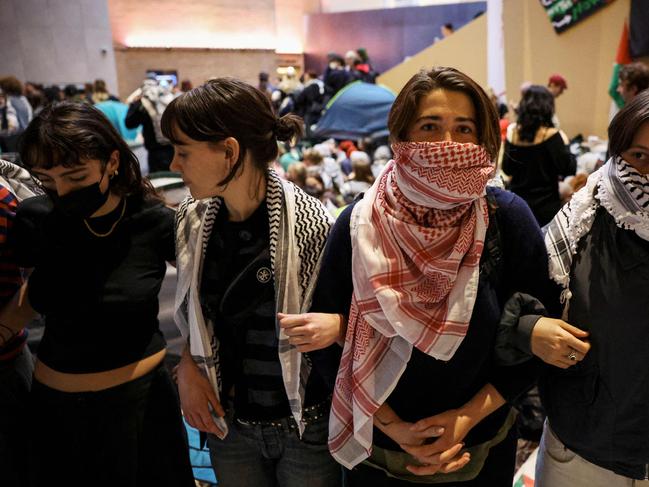 Pro-Palestinian students hold a sit-in in Melbourne on May 15, 2024 at Melbourne University's Arts West building, which the students have temporarily renamed as "Mahmoud's Hall" after Mahmoud Al Haq, a prospective University of Melbourne student, who died in Gaza. (Photo by Martin KEEP / AFP)