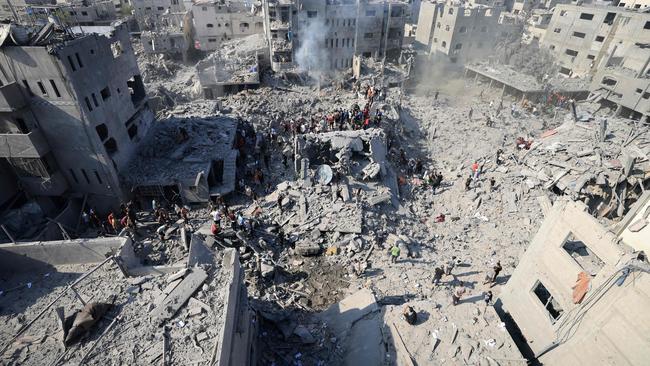 People check the rubble of buildings destroyed in an Israeli strike on the Bureij refugee camp in the central Gaza Strip on November 2. Picture: AFP