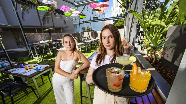 Hideaway Kitchen & Bar Function co-ordinators Emma Rodger (left) and Tiffany Brewster are frustrated Sydneysiders are locked out of visiting their Gold Coast business. Picture: Nigel Hallett