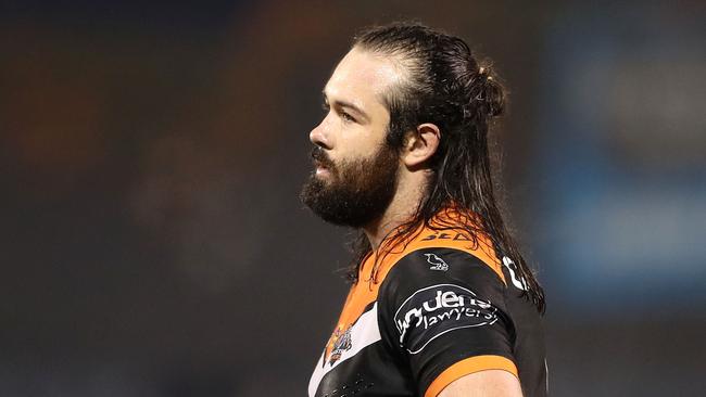 Aaron Woods of the Tigers looks on.