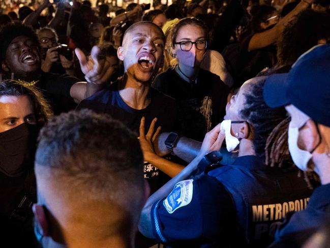 Demonstrators confront police officers in DC back in August. Picture: AFP