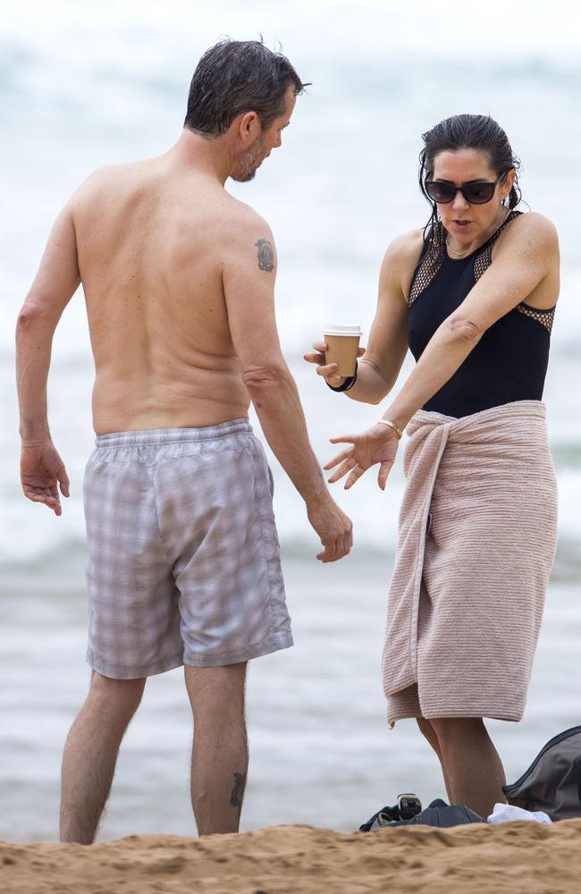 The couple take a look at how her wound’s healing. Princess Mary and her royal family hit Sydney’s Palm Beach for a dip before they head to Tasmania for an Aussie Christmas. Picture: Media Mode