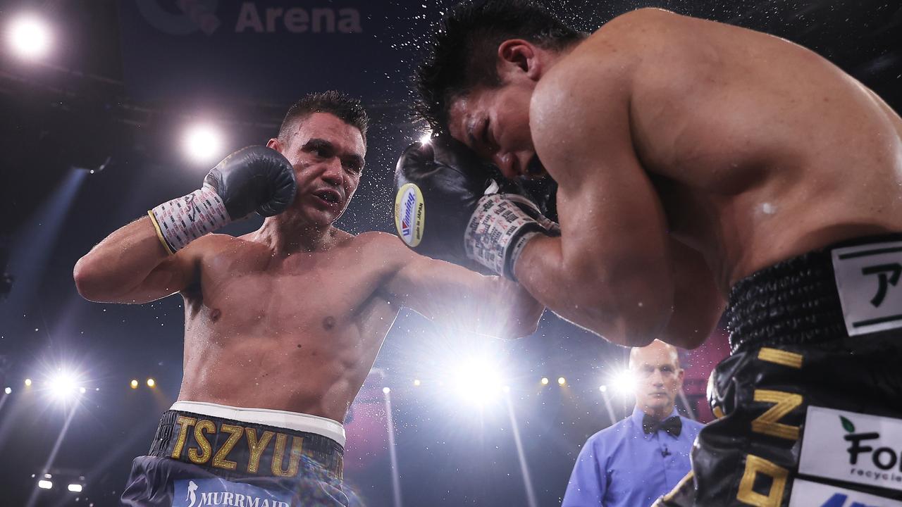 Tim Tszyu punches Takeshi Inoue during the WBO Global and Asia Pacific Super Welterweight title bout .