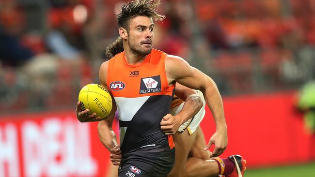 Stephen Coniglio tries to shake a Brisbane tackler. Picture: Phil Hillyard