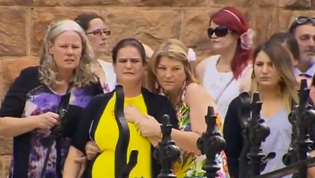 Zoe’s mum Janelle Saunders, surrounded by friends and family at her daughter’s funeral. Picture: Channel 7