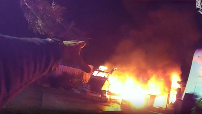 Bodywarn footage from the officer showed the caravan fully engulfed in flames when he arrived to the scene. Photo: Queensland Police