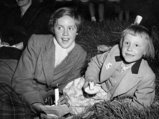 Andrea Wightman, 13, and Faye Cleland, 6, at the 1953 Carol Festival at Heidelberg.