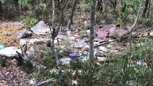 Illegal dumpers leave trails of rubbish through the woodland.