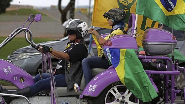 Mother-and-daughter Jair Bolsonaro supporters in Brasilia yesterday. Picture: AP