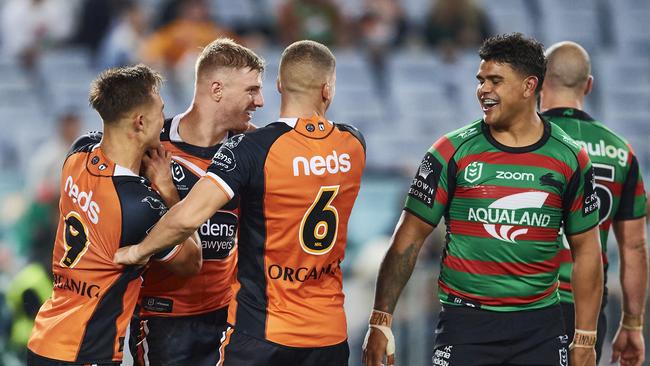 SYDNEY, AUSTRALIA - APRIL 17: Luke Garner of the Tigers celebrates with team mates after scoring a try during the round six NRL match between the South Sydney Rabbitohs and the Wests Tigers at Stadium Australia, on April 17, 2021, in Sydney, Australia. (Photo by Brett Hemmings/Getty Images)