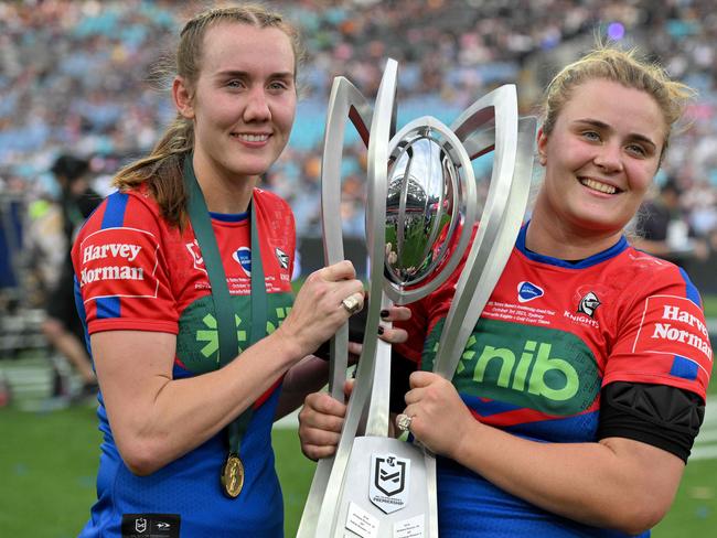 Tamika Upton (L) and Hannah Southwell (R) of the Knights pose with the Premiership Trophy after winning the women's 2023 NRL Grand Final between the Newcastle Knights and Gold Coast Titans at Accor Stadium in Sydney on October 1, 2023. (Photo by Izhar KHAN / AFP) / -- IMAGE RESTRICTED TO EDITORIAL USE - STRICTLY NO COMMERCIAL USE --