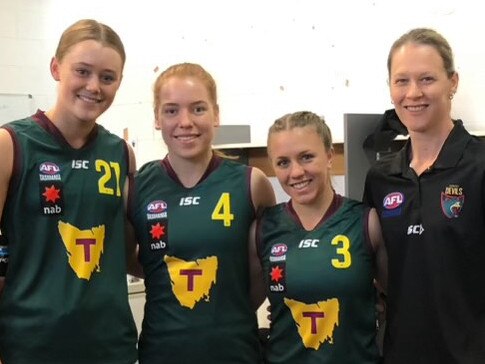 Mia King (second from left) and Deb Reynolds (right) during the North Melbourne AFLW stars' Tasmanian Devils days in 2019. Picture: Supplied