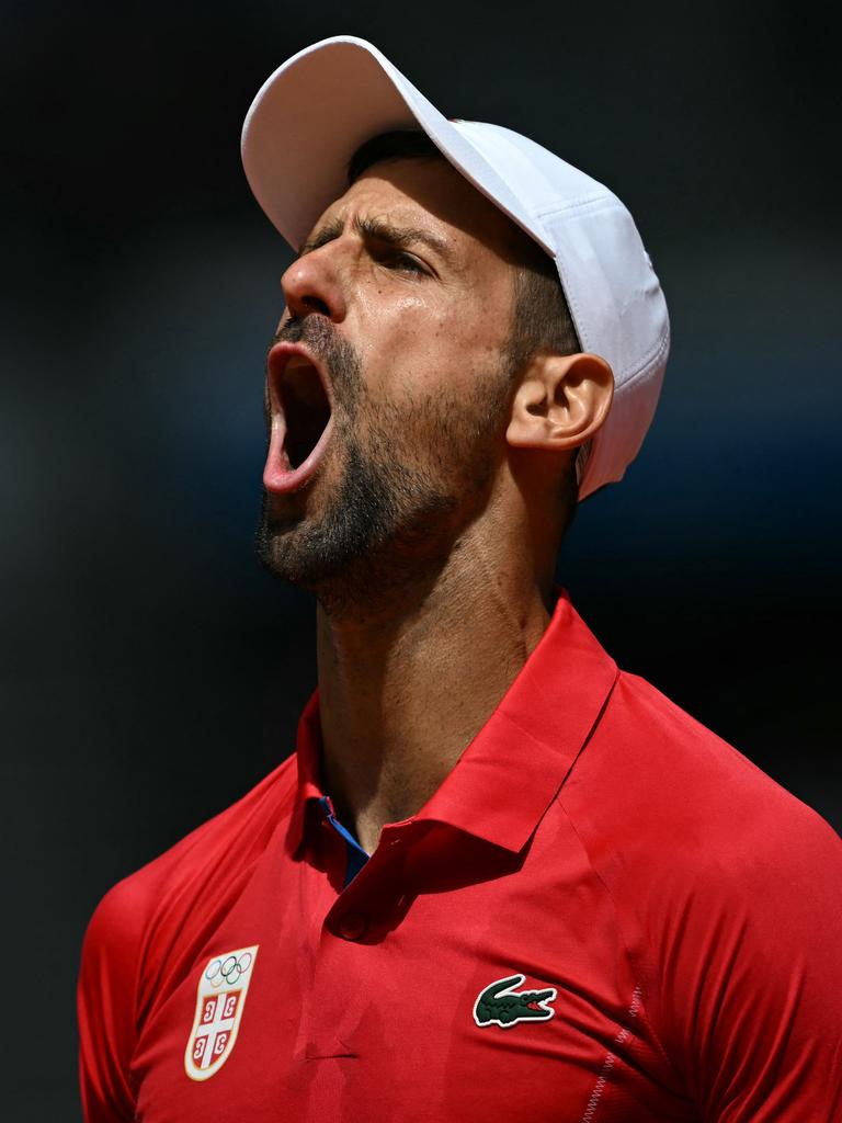 Djokovic roars. (Photo by Patricia DE MELO MOREIRA / AFP)