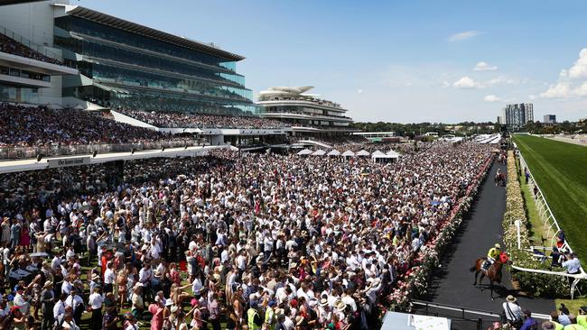 A huge crowd watches Without A Fight head out to the track for the 2023 Melbourne Cup. Picture: Michael Klein