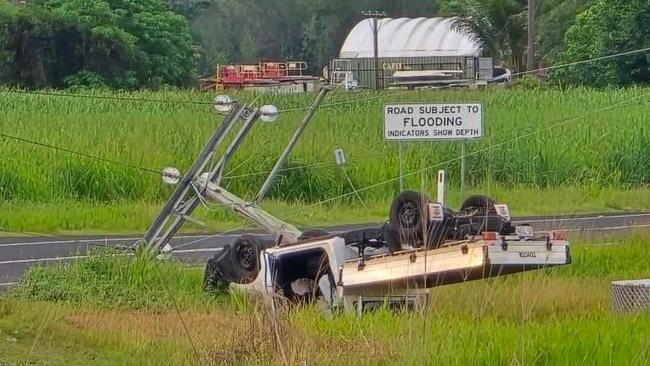 Thousands are without power and one man has been transported to hospital after a ute left the road hitting a power pole and rolling onto its roof in Yorkeys Knob. Photo: Facebook.